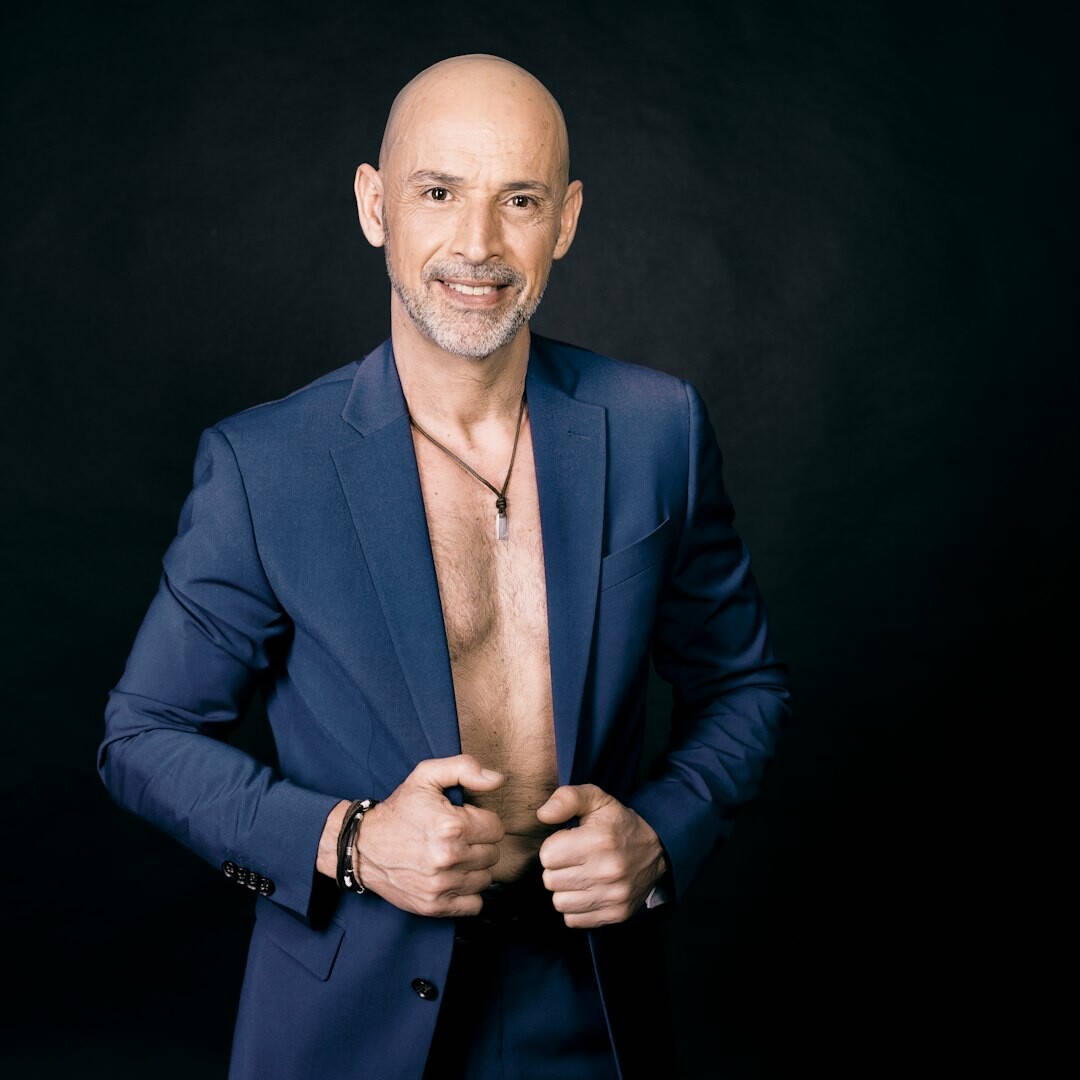 Polish TV presenter smiling confidently in studio